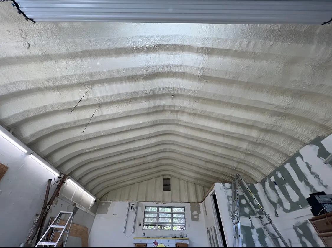 Spray polyurethane foam applied to the underside of a metal roof deck in Hyattsville